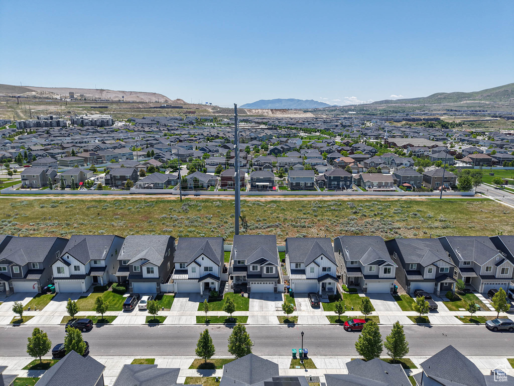 Aerial view of residential area with a mountain backdrop