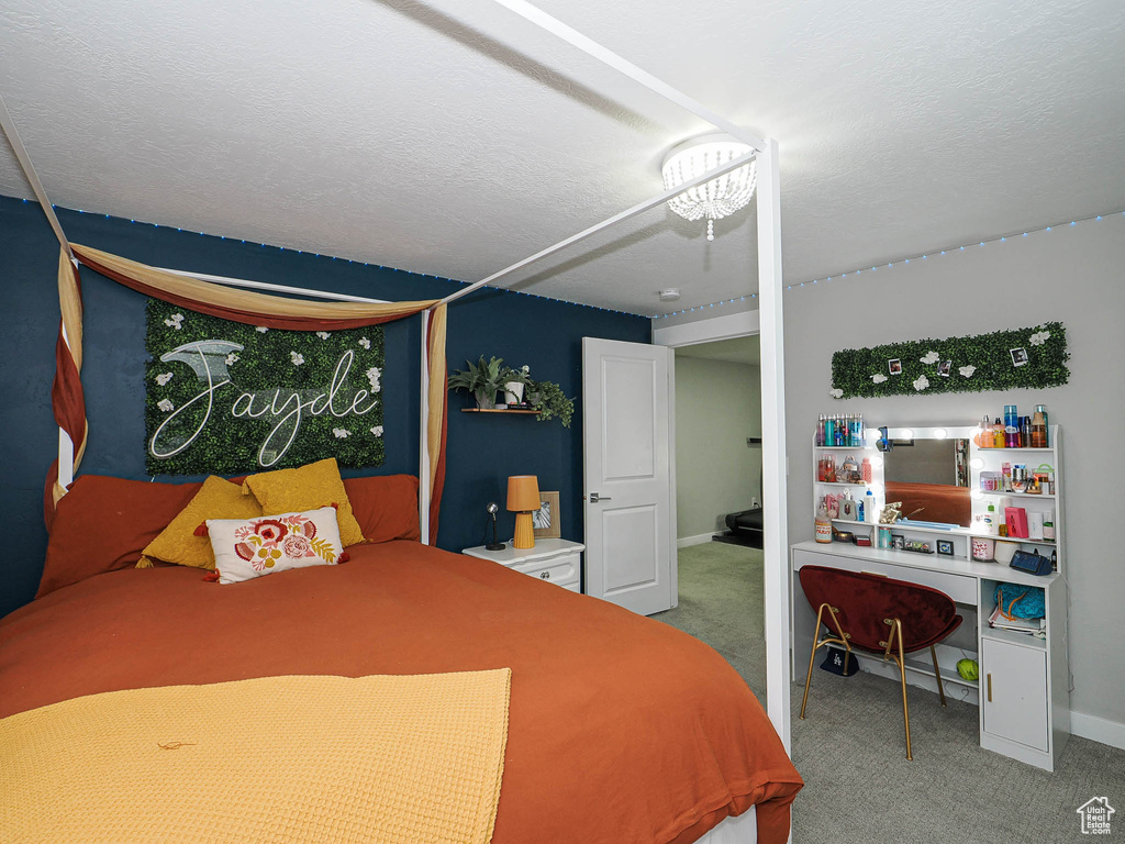 Carpeted bedroom featuring baseboards