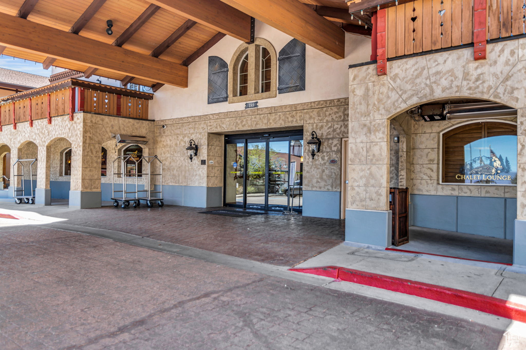 View of exterior entry with stone siding