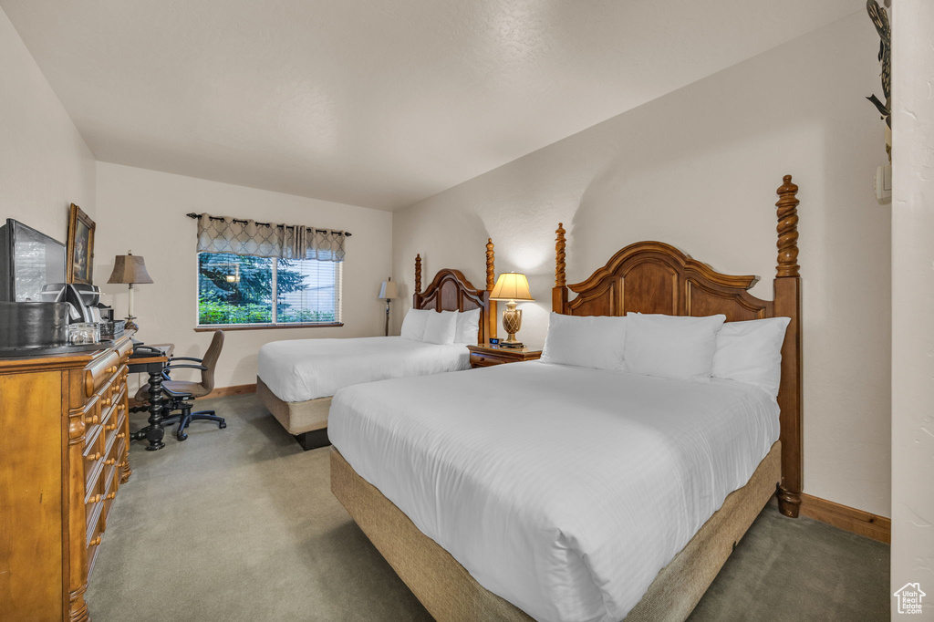 Bedroom with carpet floors and baseboards