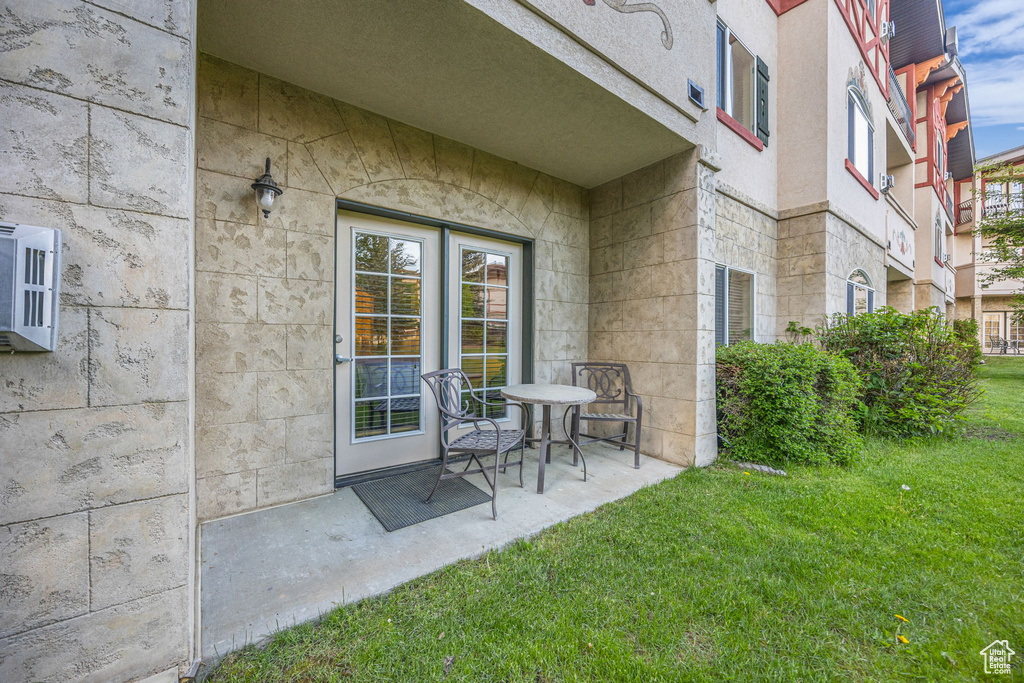 Entrance to property with a lawn