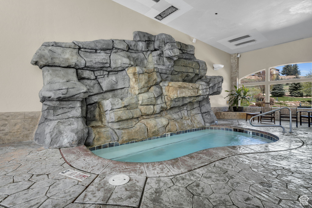 View of pool featuring a patio area and a swimming pool