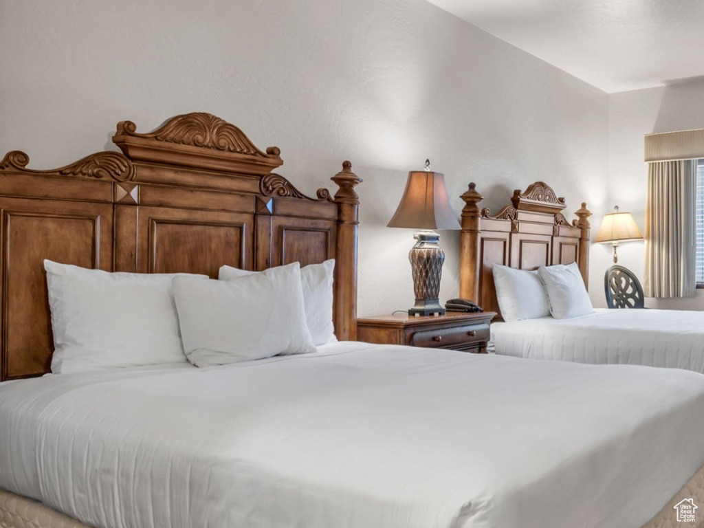 Bedroom featuring carpet flooring and baseboards