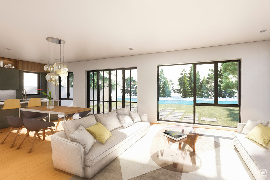 Living area with light wood-style floors and a chandelier