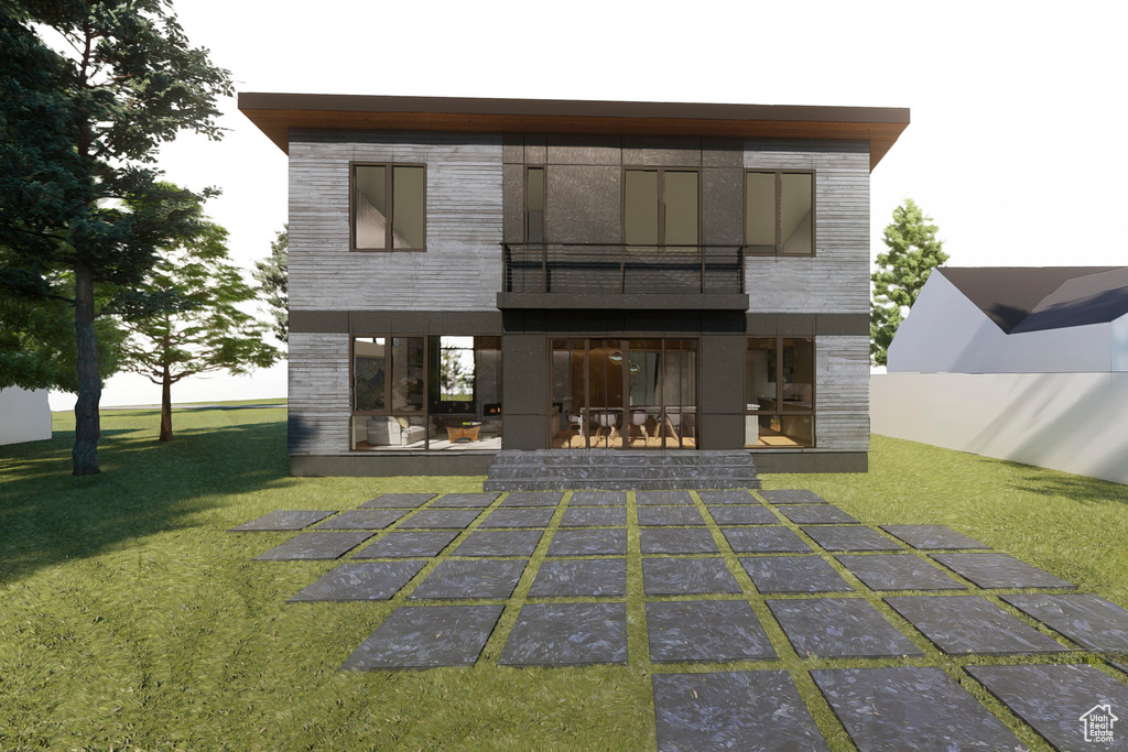 Rear view of house featuring a balcony, a yard, a patio area, and uncovered parking