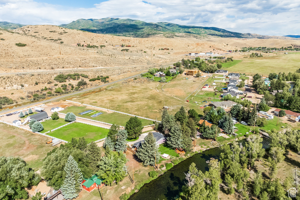 Aerial view of sparsely populated area with a mountain backdrop