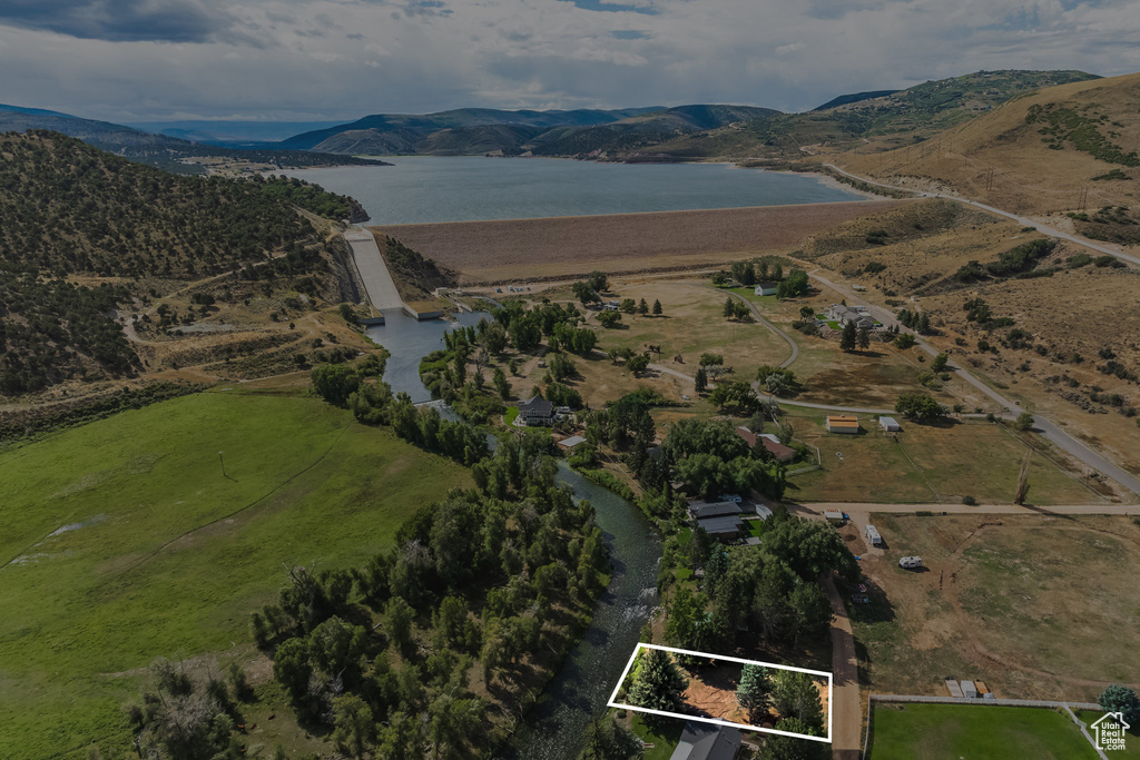 View of property location with a water and mountain view and property boundaries highlighted