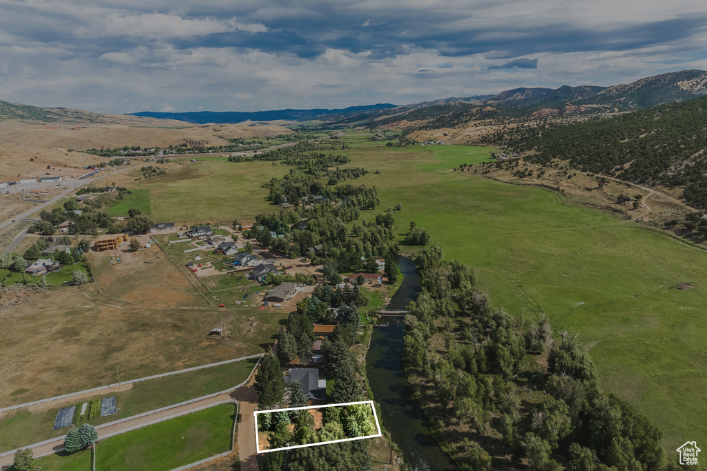 Overview of rural landscape featuring property boundaries highlighted and mountains