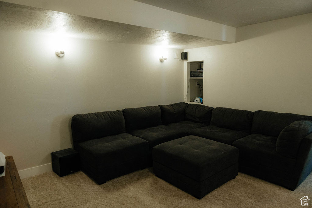 Living room featuring light carpet and baseboards