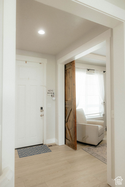 Foyer entrance featuring light wood-type flooring and recessed lighting