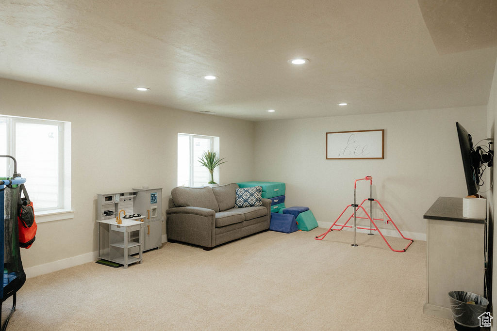 Recreation room featuring carpet, recessed lighting, and baseboards