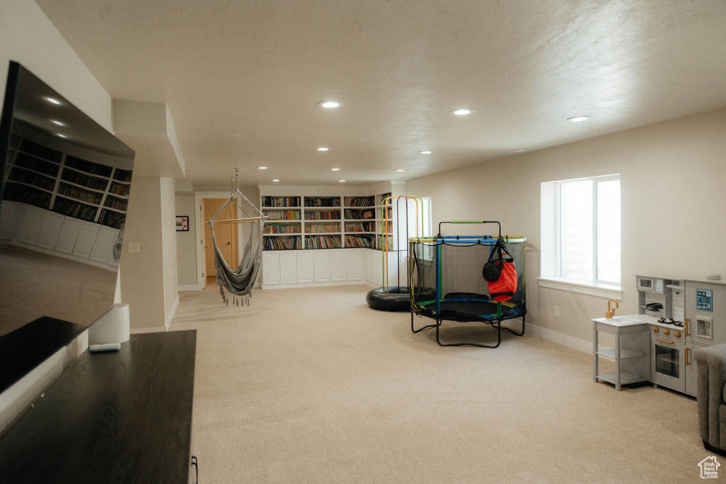 Recreation room with carpet flooring, recessed lighting, and baseboards