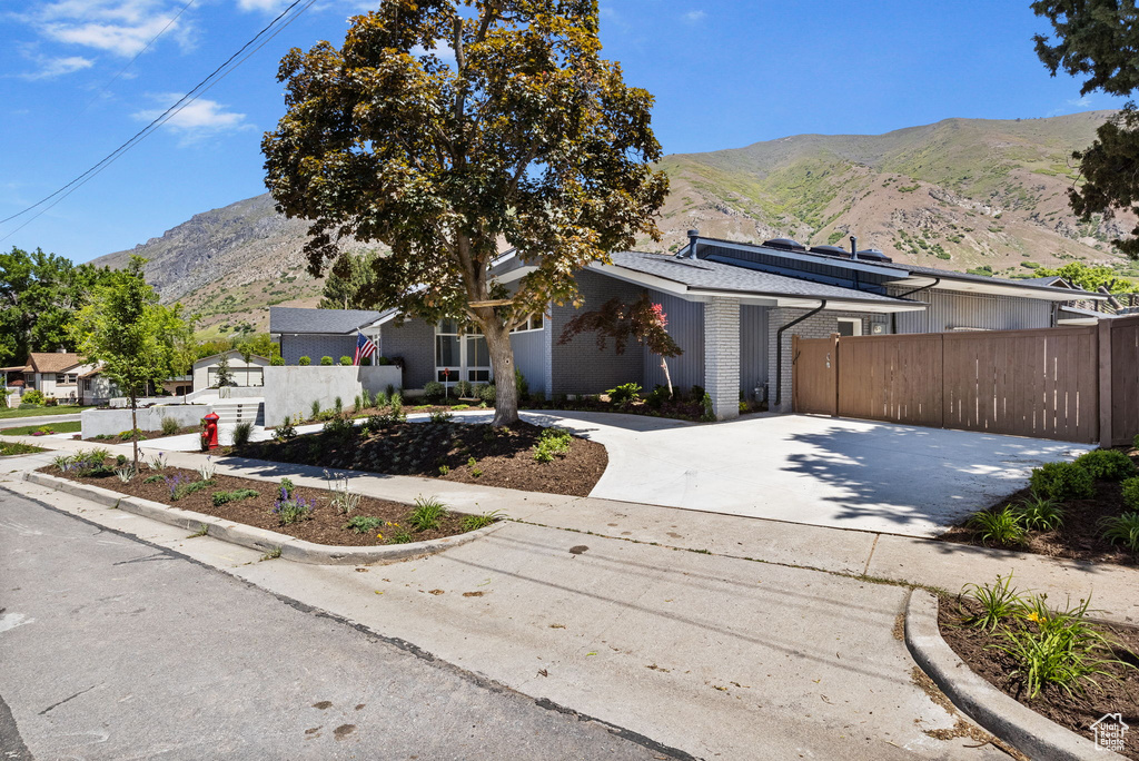 Mid-century modern home with a mountain view and brick siding