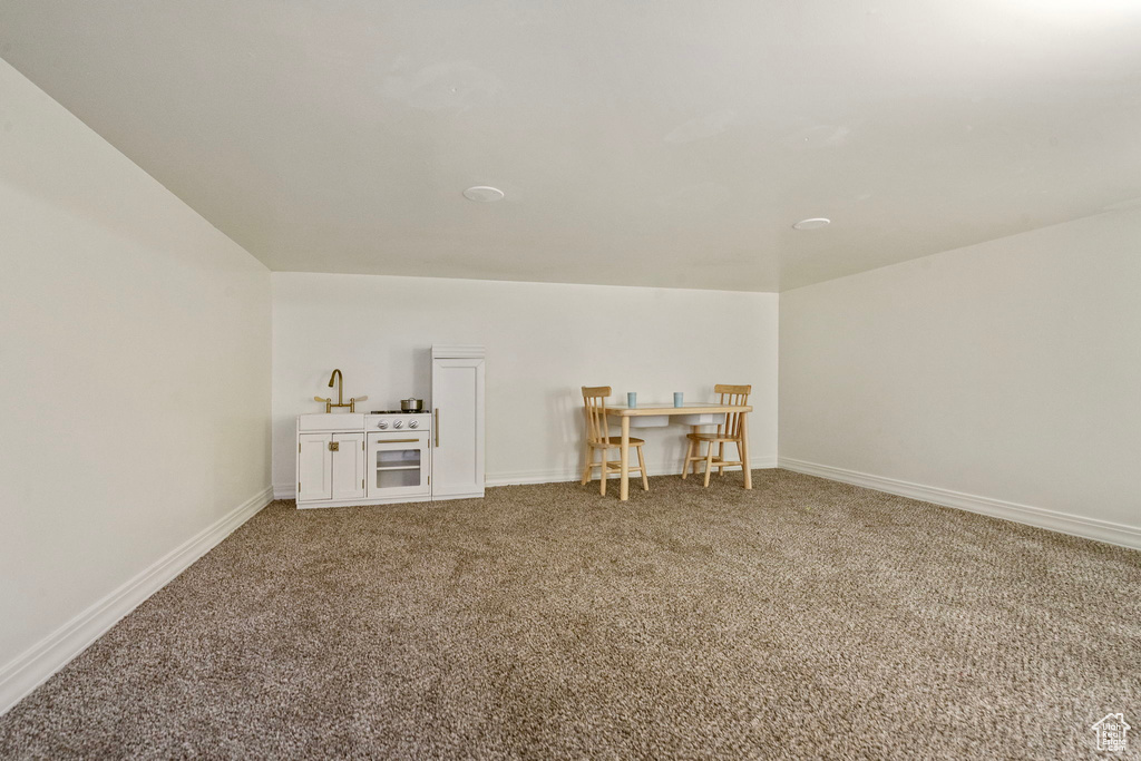 Bonus room featuring carpet flooring and baseboards