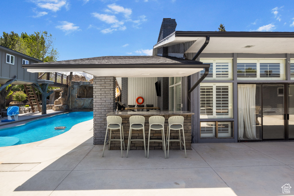 Swimming pool with a patio