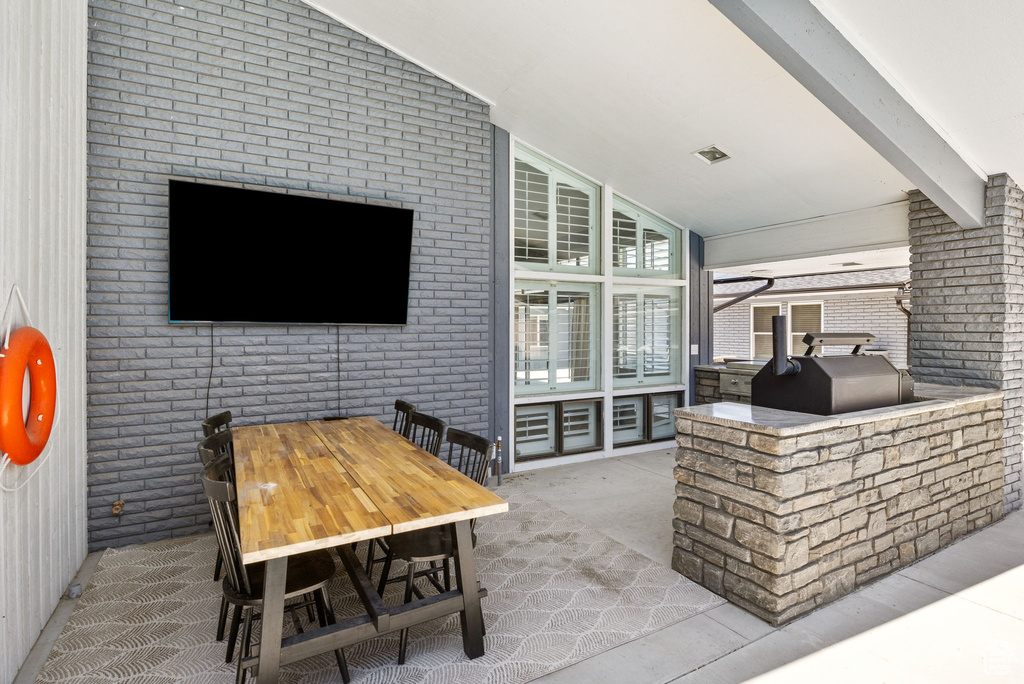 View of patio with outdoor dining area