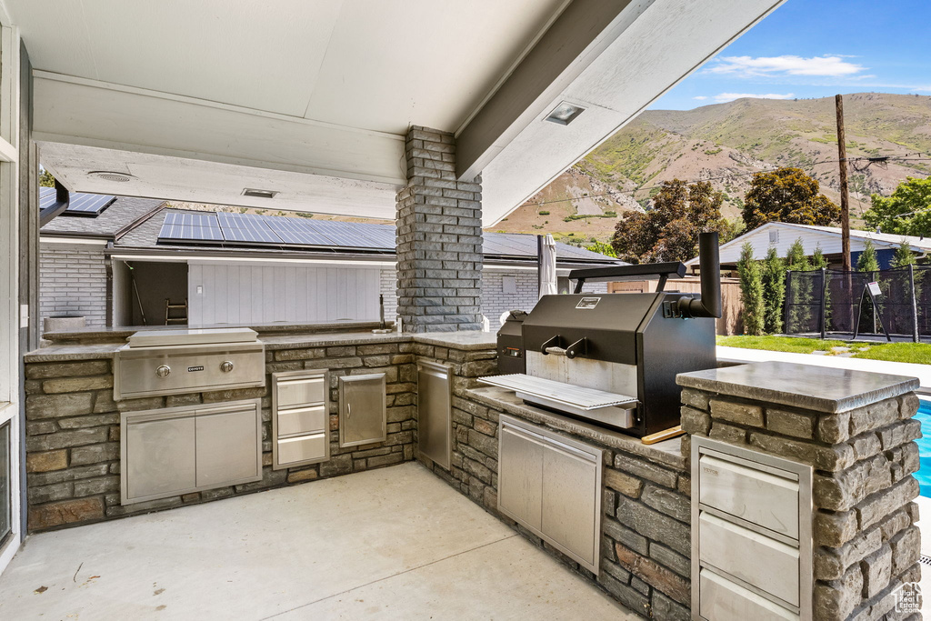 View of patio / terrace with a mountain view
