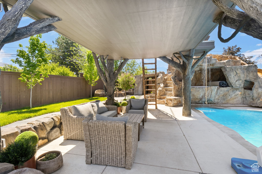 Fenced backyard with stairway, a patio area, and an outdoor hangout area
