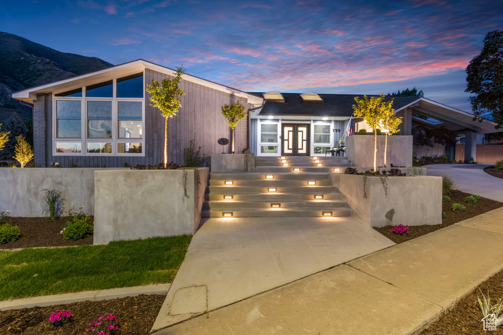Mid-century modern home featuring driveway