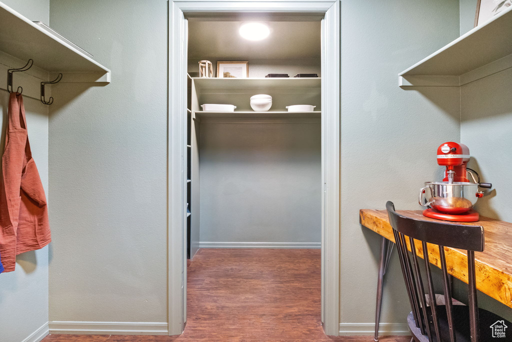 Spacious closet featuring wood finished floors