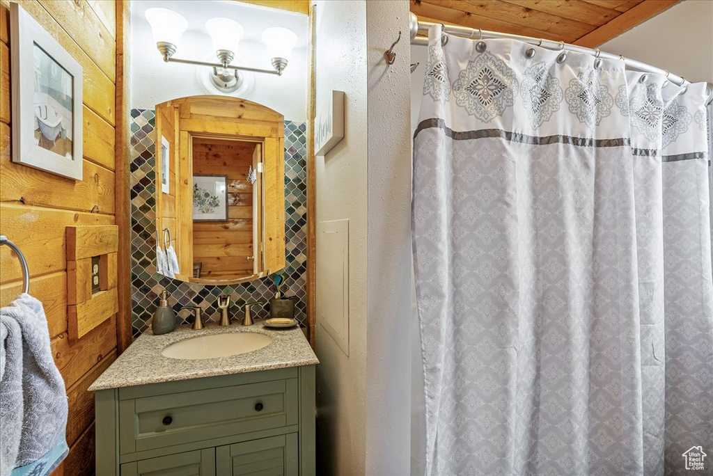 Full bathroom featuring vanity and curtained shower
