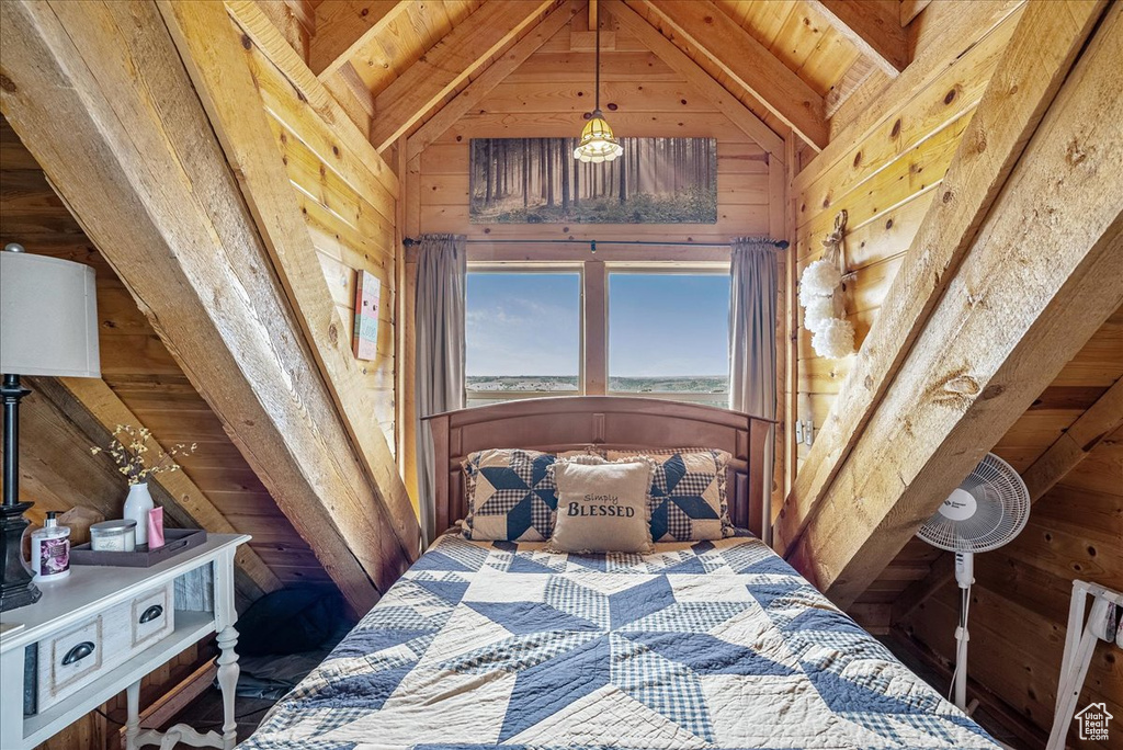 Bedroom with wood walls