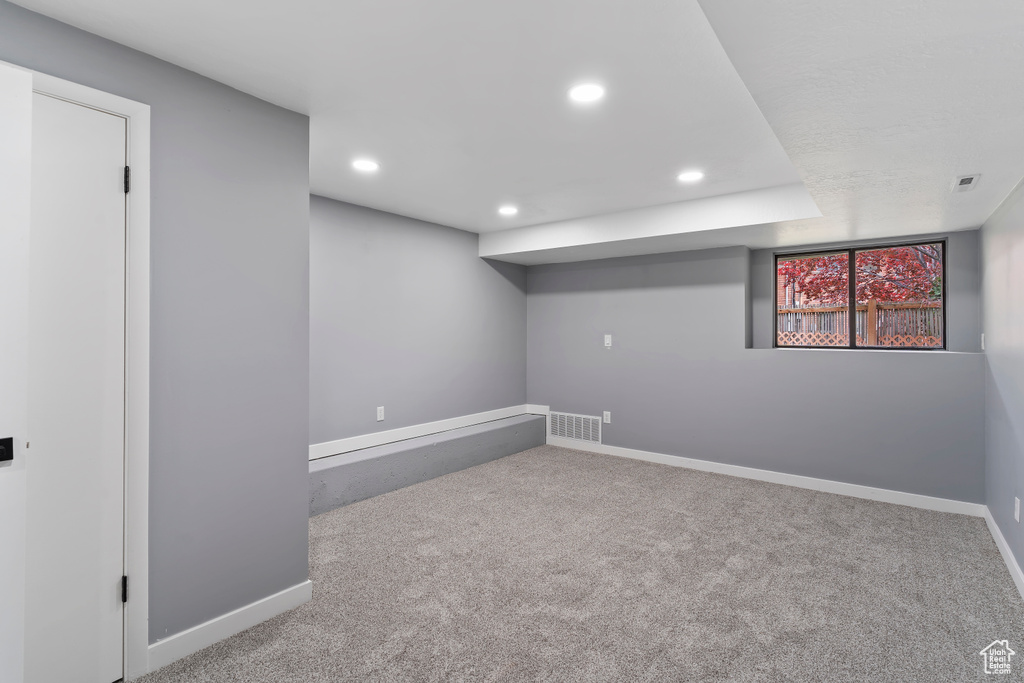 Below grade area featuring carpet flooring, baseboards, and recessed lighting