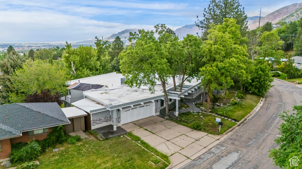 View of subject property with a mountain backdrop