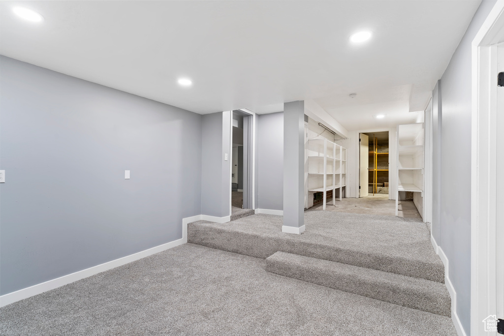 Basement featuring carpet, recessed lighting, and baseboards