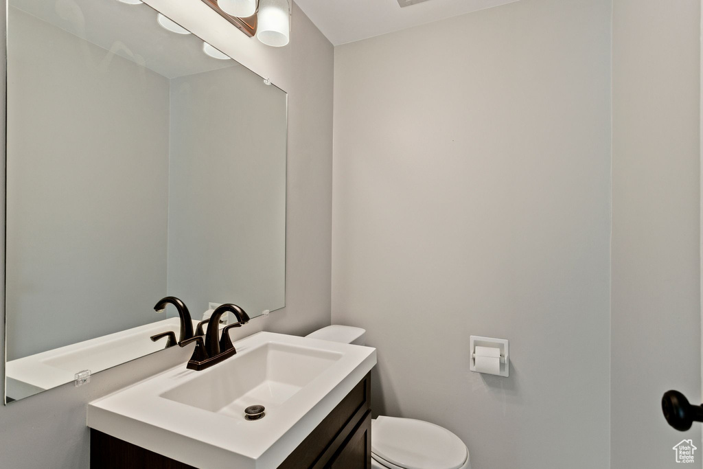 Bathroom with vanity and toilet