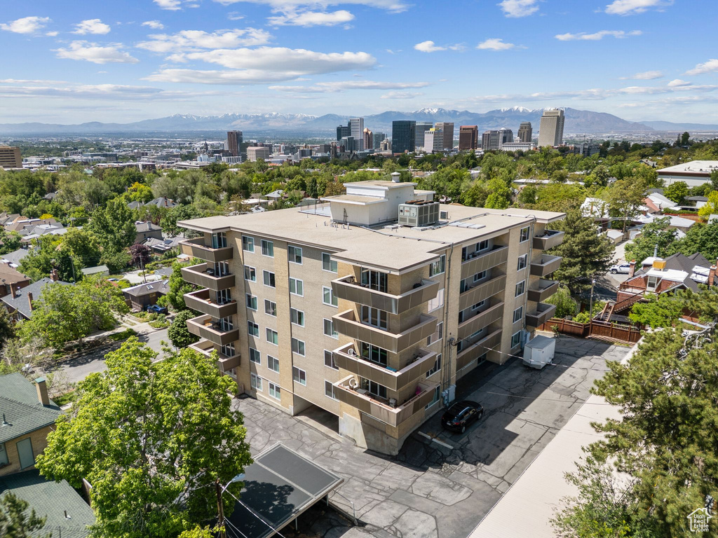 View of property featuring a mountain view and a city view