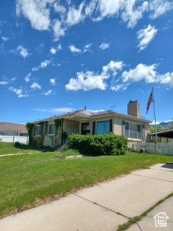Ranch-style home with a chimney