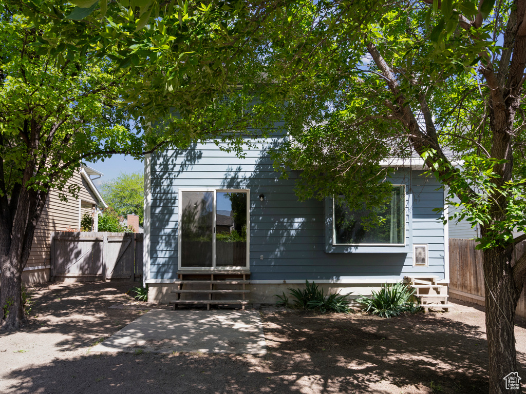 Rear view of property with entry steps