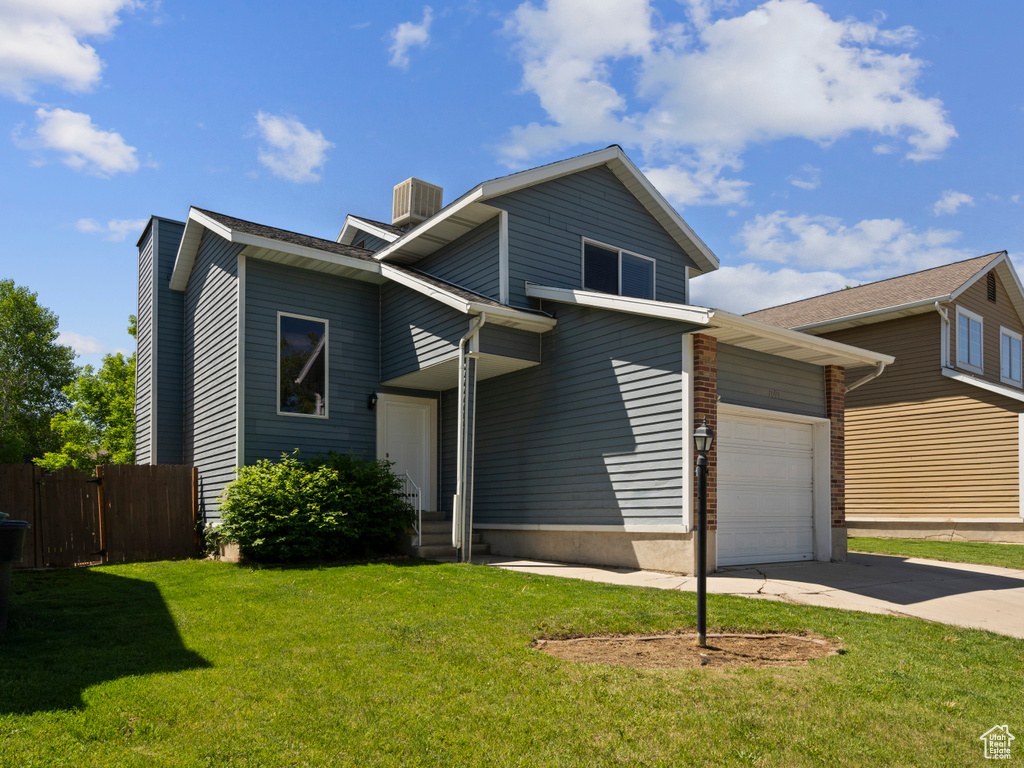 View of front of home featuring driveway, an attached garage, central air condition unit, and entry steps
