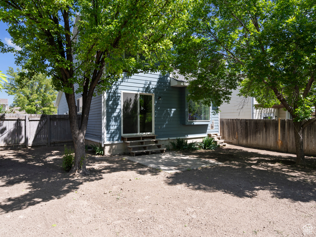 Back of house featuring entry steps