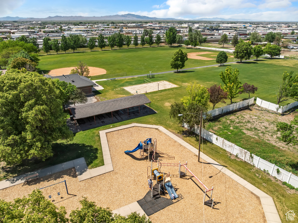 Drone / aerial view of mountains, a recreational park, and a golf course