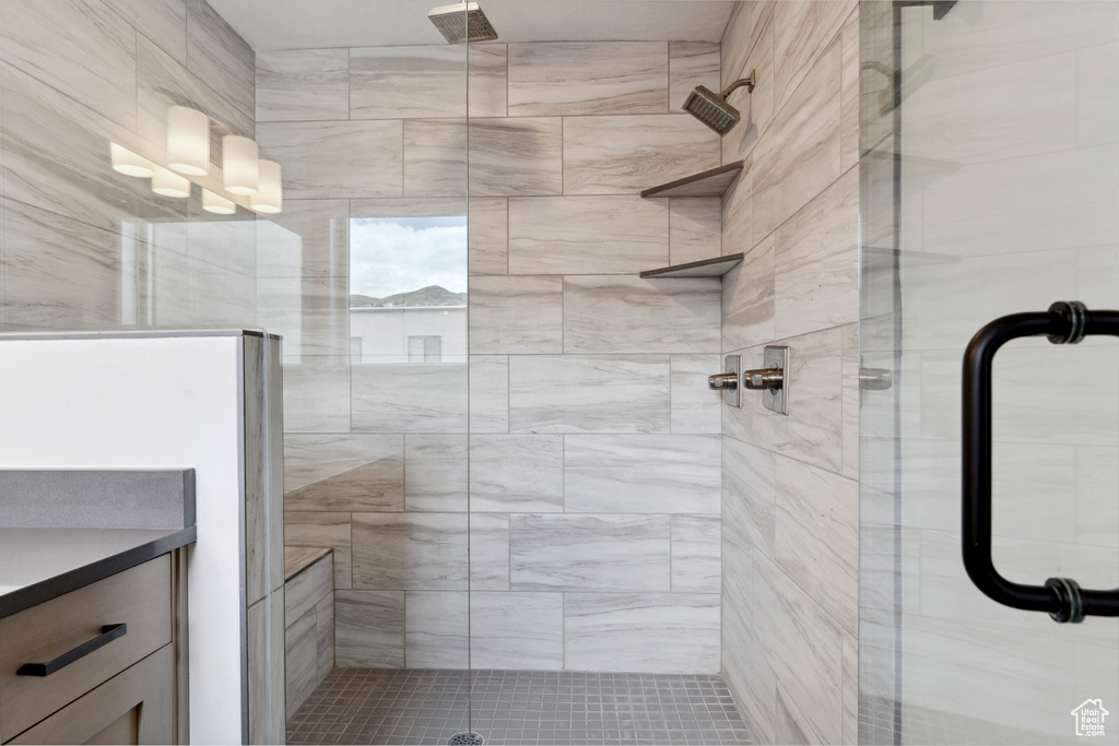 Full bath featuring a shower stall