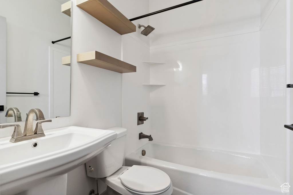 Full bathroom with a sink, toilet, and bathtub / shower combination