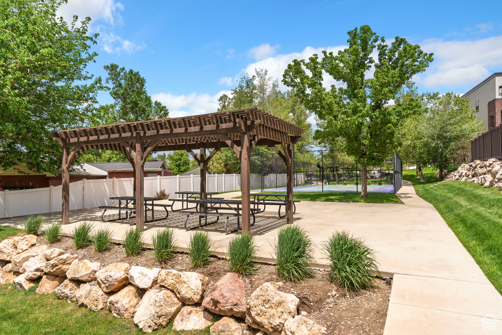 View of home\'s community with a pergola and a patio area
