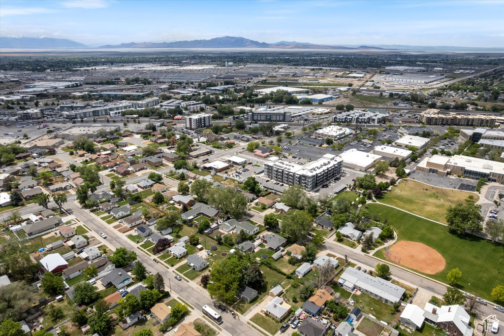 Aerial overview of property's location featuring a mountain backdrop