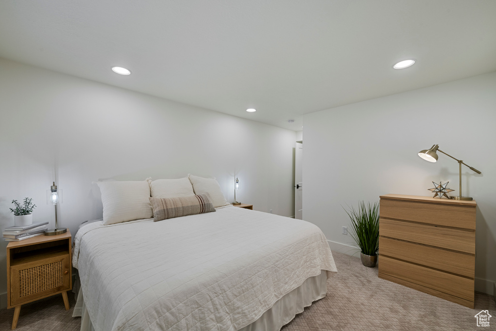 Bedroom featuring recessed lighting, light colored carpet, and baseboards