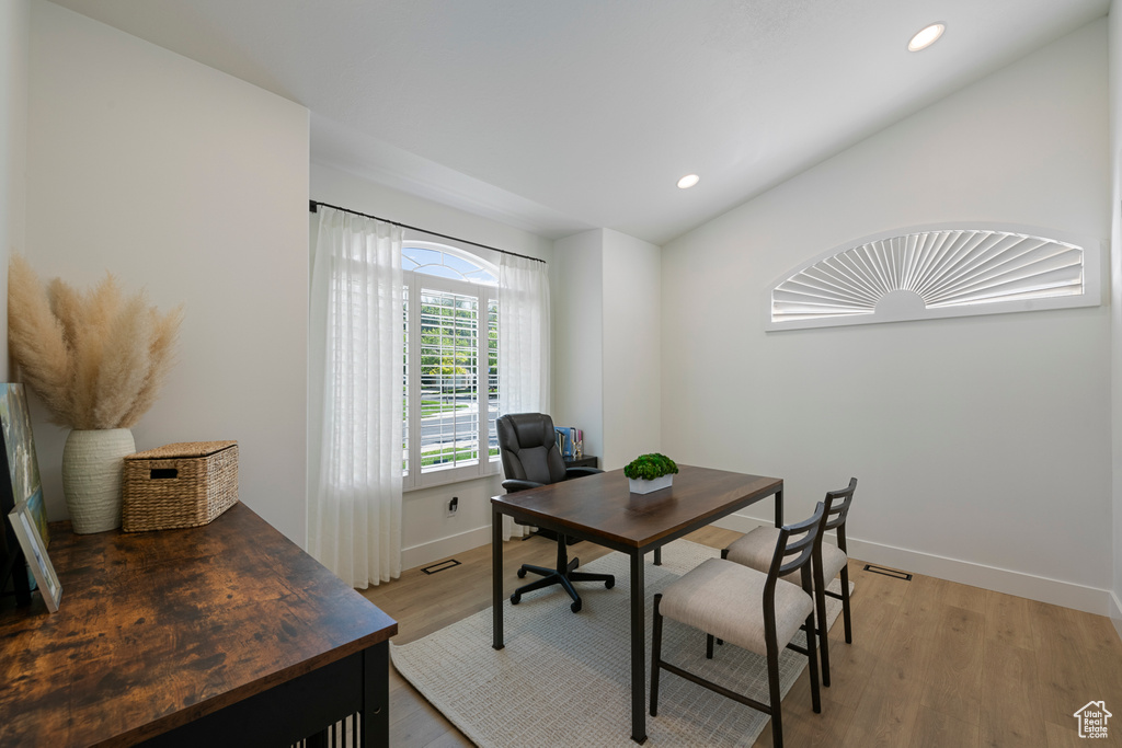 Home office with baseboards, recessed lighting, light wood finished floors, and lofted ceiling