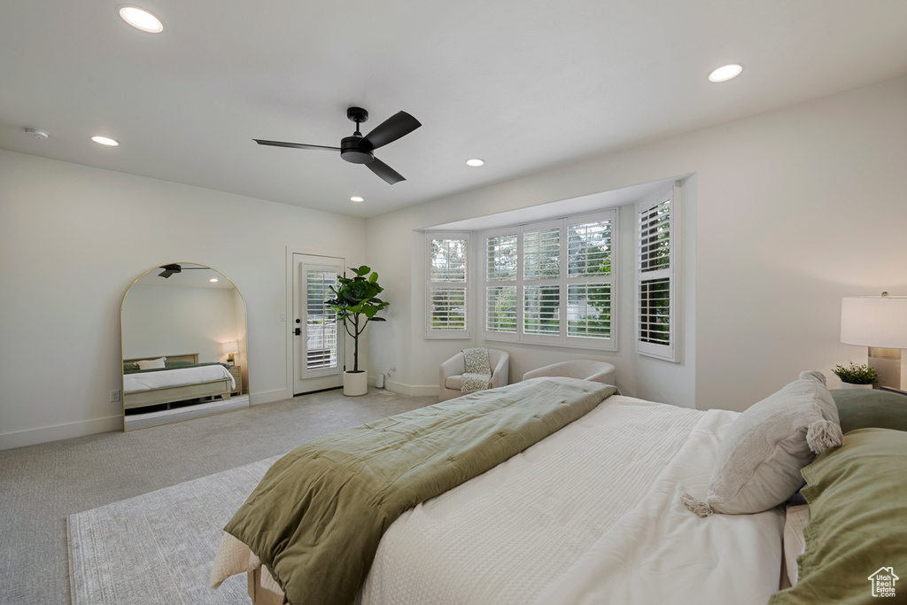 Bedroom with recessed lighting, light colored carpet, baseboards, and ceiling fan