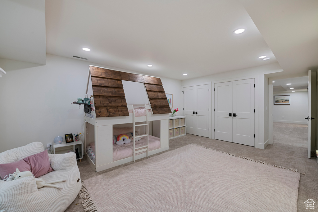 Living area featuring recessed lighting, carpet flooring, and baseboards