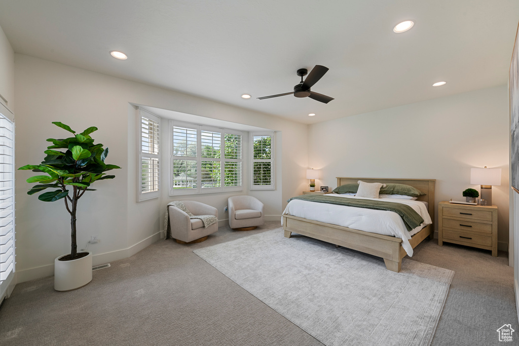 Carpeted bedroom with recessed lighting, ceiling fan, and baseboards