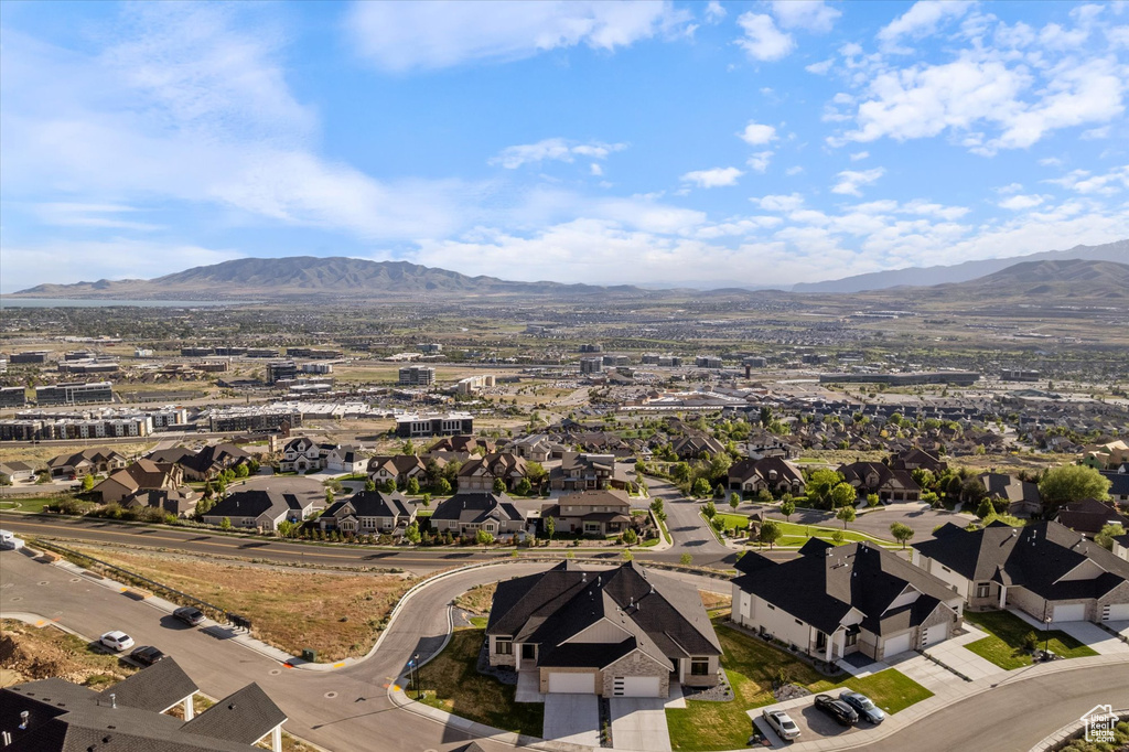 Aerial perspective of suburban area with a mountain backdrop