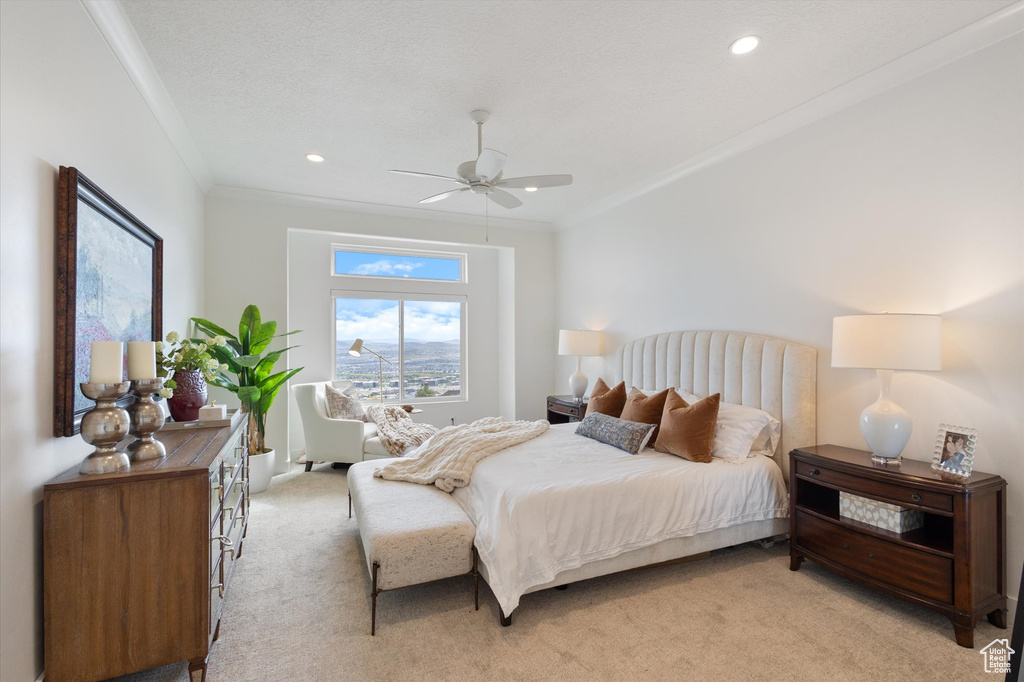 Bedroom with light carpet, ornamental molding, recessed lighting, and a ceiling fan