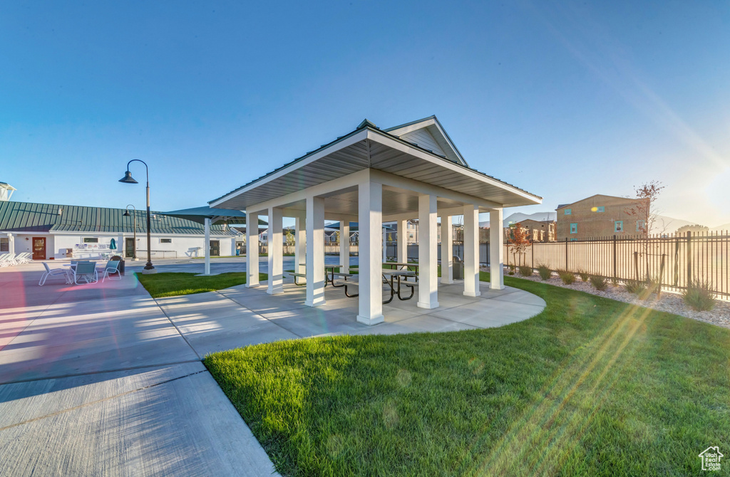 View of home\\\'s community with a gazebo, fence, and a yard