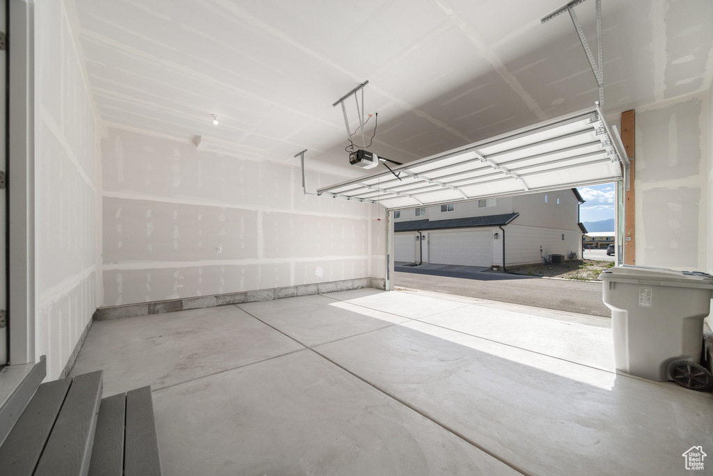Garage featuring a garage door opener