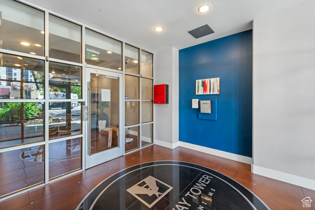 Community lobby with recessed lighting and floor to ceiling windows
